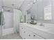 Well-lit bathroom featuring a double sink vanity, a shower with tub, and elegant decor at 6681 Wisteria Dr., Myrtle Beach, SC 29588
