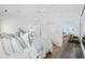 Bright bedroom boasting a ceiling fan, hardwood floors, and a walk-in closet at 6681 Wisteria Dr., Myrtle Beach, SC 29588