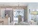 Bright dining area adjacent to the kitchen, featuring sliding doors that lead to outdoor patio and backyard at 6681 Wisteria Dr., Myrtle Beach, SC 29588