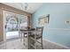Cozy dining area with sliding glass doors, perfect for enjoying meals while looking at nature views at 6681 Wisteria Dr., Myrtle Beach, SC 29588
