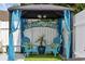 Gazebo featuring comfortable outdoor seating with 'Welcome to the Beach' decor at 6681 Wisteria Dr., Myrtle Beach, SC 29588