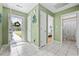 Bright hallway featuring tile flooring and multiple doorways leading to other rooms at 6681 Wisteria Dr., Myrtle Beach, SC 29588