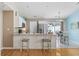 Lovely eat-in kitchen featuring an island, modern appliances, and a breakfast nook with access to outdoor space at 6681 Wisteria Dr., Myrtle Beach, SC 29588