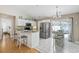 Charming kitchen with counter seating, stainless steel appliances, and sliding glass doors for indoor-outdoor dining at 6681 Wisteria Dr., Myrtle Beach, SC 29588