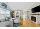 Cozy living room with hardwood floors, stylish decor, and a decorative fireplace for a warm and inviting atmosphere at 6681 Wisteria Dr., Myrtle Beach, SC 29588