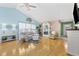 Comfortable living room with wood floors, vaulted ceilings, and plenty of natural light at 6681 Wisteria Dr., Myrtle Beach, SC 29588