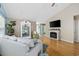 Bright living room features fireplace, hardwood floors, and beach-inspired decorations at 6681 Wisteria Dr., Myrtle Beach, SC 29588