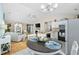 Open-concept living space with a modern kitchen, dining area, and comfortable living room for seamless entertaining at 6681 Wisteria Dr., Myrtle Beach, SC 29588