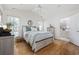 Serene bedroom with a king-sized bed, soft color palette, and an en-suite bathroom for ultimate relaxation at 6681 Wisteria Dr., Myrtle Beach, SC 29588