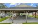 Outdoor wooden pavilion offering picnic tables, concrete floor, and room for activities at 6681 Wisteria Dr., Myrtle Beach, SC 29588