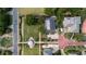 Expansive aerial shot of the home showcasing its beautiful landscaping, driveway, and surrounding lush greenery at 70 Beachwalker Ct., Georgetown, SC 29440