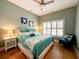 Inviting bedroom showcasing a comfortable bed, a window with shutters, and nautical-themed decor at 70 Beachwalker Ct., Georgetown, SC 29440
