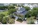 A detailed aerial shot captures the home's architecture, surrounded by lush landscaping and hardscaped driveway at 70 Beachwalker Ct., Georgetown, SC 29440