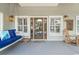 Relaxing front porch featuring a swing, rocking chair, and coastal decor, perfect for enjoying the outdoors at 70 Beachwalker Ct., Georgetown, SC 29440