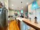 Gourmet kitchen with stainless steel appliances, a granite island, and adjacent dining space at 70 Beachwalker Ct., Georgetown, SC 29440