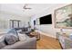 Comfortable living room featuring a plush sofa, hardwood floors, and stylish decor, perfect for relaxing and entertaining at 70 Beachwalker Ct., Georgetown, SC 29440