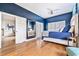 Spacious main bedroom featuring hardwood floors, a large window, and access to an ensuite bathroom at 70 Beachwalker Ct., Georgetown, SC 29440