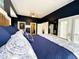 Tranquil main bedroom with hardwood floors, walk-in closet, private patio access, and neutral color scheme at 70 Beachwalker Ct., Georgetown, SC 29440