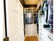 Organized walk-in closet featuring custom shelving, drawers, hanging rods, and ample storage space at 70 Beachwalker Ct., Georgetown, SC 29440