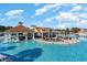 Resort style pool with a swim up bar, in water seating, and patio dining at 7183 Shooting Star Way, Myrtle Beach, SC 29579