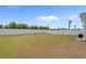 Large grass backyard surrounded by privacy fence provides space for outdoor activities and leisure at 753 Enchantment Loop, Myrtle Beach, SC 29588