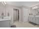 Modern bathroom features double sinks, granite countertops, tile floors, and closet space at 753 Enchantment Loop, Myrtle Beach, SC 29588