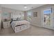 Beautiful bedroom featuring a unique white bed frame, carpet flooring, and ample natural light from the window at 753 Enchantment Loop, Myrtle Beach, SC 29588