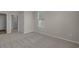 Cozy bedroom showcasing neutral walls, plush carpet flooring, and a bright window with blinds at 753 Enchantment Loop, Myrtle Beach, SC 29588
