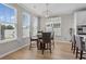 Dining area with hardwood floors, lots of natural light, and a modern light fixture at 753 Enchantment Loop, Myrtle Beach, SC 29588