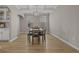 Traditional dining room with hardwood floors, wainscoting, and a modern chandelier fixture at 753 Enchantment Loop, Myrtle Beach, SC 29588