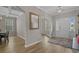 Bright foyer featuring hardwood floors, trimwork, and a clear view of the living spaces at 753 Enchantment Loop, Myrtle Beach, SC 29588