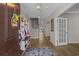 Inviting foyer with hardwood floors, a staircase, and convenient storage features with warm neutral paint at 753 Enchantment Loop, Myrtle Beach, SC 29588