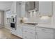 This kitchen features white cabinets, subway tile backsplash, stainless steel appliances and a gas cooktop at 753 Enchantment Loop, Myrtle Beach, SC 29588