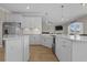 Modern kitchen with white cabinets, stainless steel appliances, and an open concept design at 753 Enchantment Loop, Myrtle Beach, SC 29588