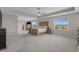 Spacious main bedroom features tray ceilings, carpet floors, ensuite bathroom, and lots of natural light at 753 Enchantment Loop, Myrtle Beach, SC 29588