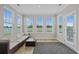 Bright sunroom with lots of windows providing natural light and a comfortable seating area at 753 Enchantment Loop, Myrtle Beach, SC 29588