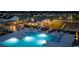 Aerial view of community pool, grilling area, and manicured landscaping at night at 755 St. Vincent Loop, Little River, SC 29566