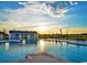 Relaxing community pool with sun loungers, palm trees, and beautiful sunsets at 755 St. Vincent Loop, Little River, SC 29566
