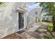 Back entrance of the home with a covered porch and adjacent landscaping at 800 9Th Ave. S # E-4, North Myrtle Beach, SC 29582
