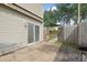 Backyard featuring a covered patio and fenced area leading to green space at 800 9Th Ave. S # E-4, North Myrtle Beach, SC 29582