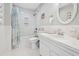 Bright bathroom with classic white tile, bathtub, and vanity at 800 9Th Ave. S # E-4, North Myrtle Beach, SC 29582