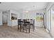 Dining area with new flooring, a window, and a view of the kitchen at 800 9Th Ave. S # E-4, North Myrtle Beach, SC 29582