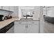 Updated kitchen view with granite countertops and white cabinetry at 800 9Th Ave. S # E-4, North Myrtle Beach, SC 29582
