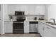 Modern kitchen with stainless steel appliances and white cabinetry at 800 9Th Ave. S # E-4, North Myrtle Beach, SC 29582
