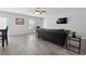 Inviting living room with a dark leather sofa and stylish decor at 800 9Th Ave. S # E-4, North Myrtle Beach, SC 29582