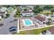 Aerial view of a community pool with lounge chairs and a parking area, nestled within a residential neighborhood at 800 9Th Ave. S # E-4, North Myrtle Beach, SC 29582