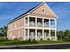Beautiful two-story home with double porches, white railings, and shutters with great curb appeal at 8163 Wood Pass Lane, Myrtle Beach, SC 29572