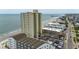 Aerial view of condo building near beach and ocean with many resort buildings surrounding at 912 N Waccamaw Dr. # 904, Garden City Beach, SC 29576