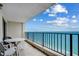 Enjoy the ocean view from this condo's private balcony, complete with seating for outdoor dining and relaxation at 912 N Waccamaw Dr. # 904, Garden City Beach, SC 29576