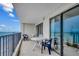 A condo balcony with comfortable seating and views of the beach and ocean for relaxation and enjoyment at 912 N Waccamaw Dr. # 904, Garden City Beach, SC 29576